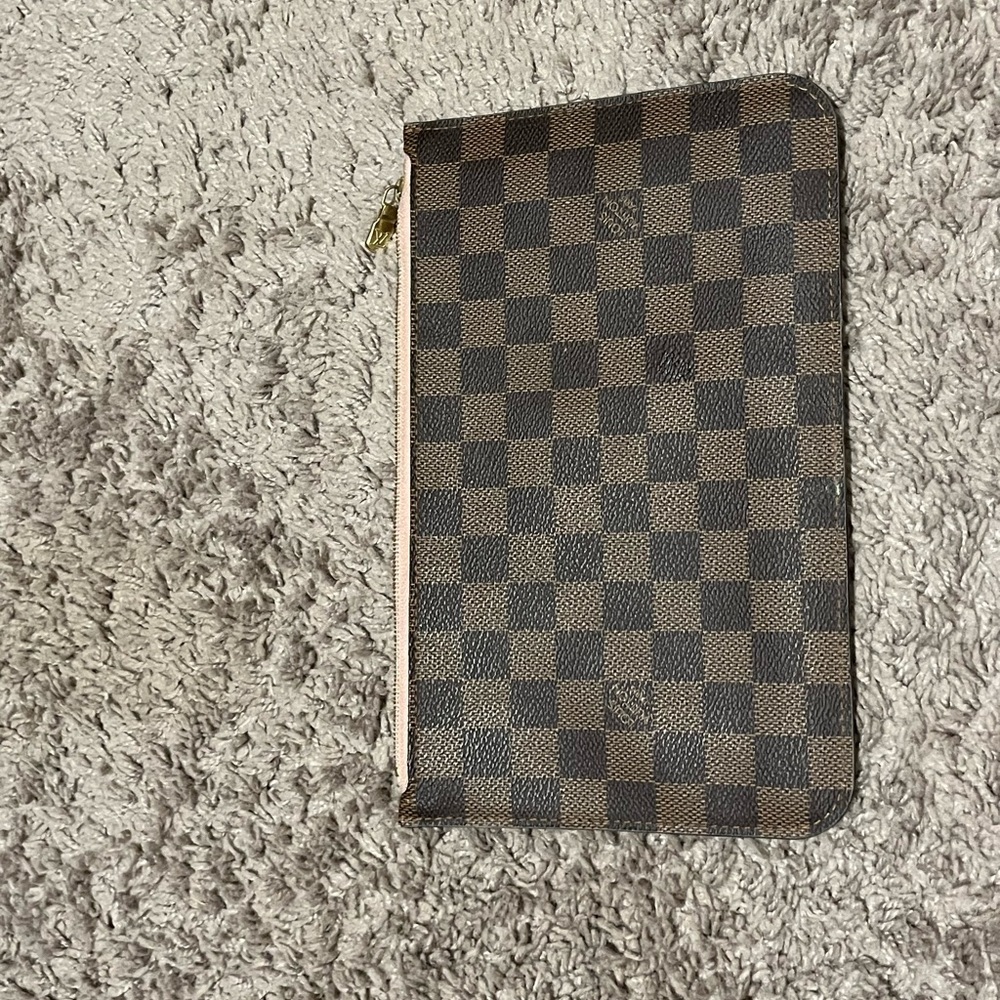 Neverfull Zippered Wristlet pouch - some wear inside as price is reflective.